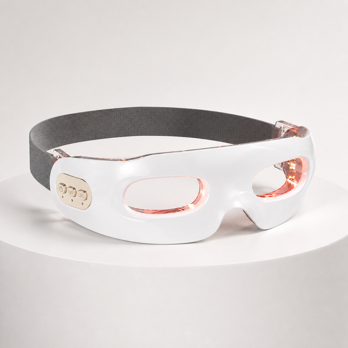 Rechargeable red light vibration eye massager in white